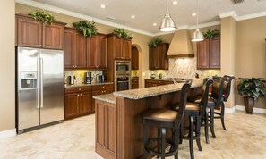 Fridge, microwave, oven, stovetop - Radiant Retreat with Golf Course Views at Reunion (Kissimmee)