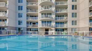 A multi-story hotel with a swimming pool. - Island Princess 609 * Gulf front~Beach Chair Set Included * Salt Water Vacations (Fort Walton Beach)