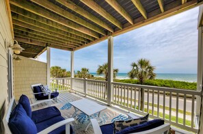 A covered outdoor seating area with a view of the ocean. - Relax at 'Sea Star 308' – A Coastal Luxury Retreat (Surf City)