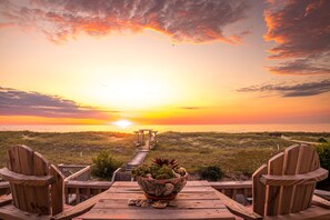 Relax on the deck with Adirondack chairs overlooking the ocean view.