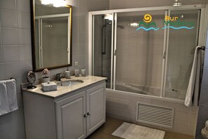 Bathtub, hair dryer, bidet, towels