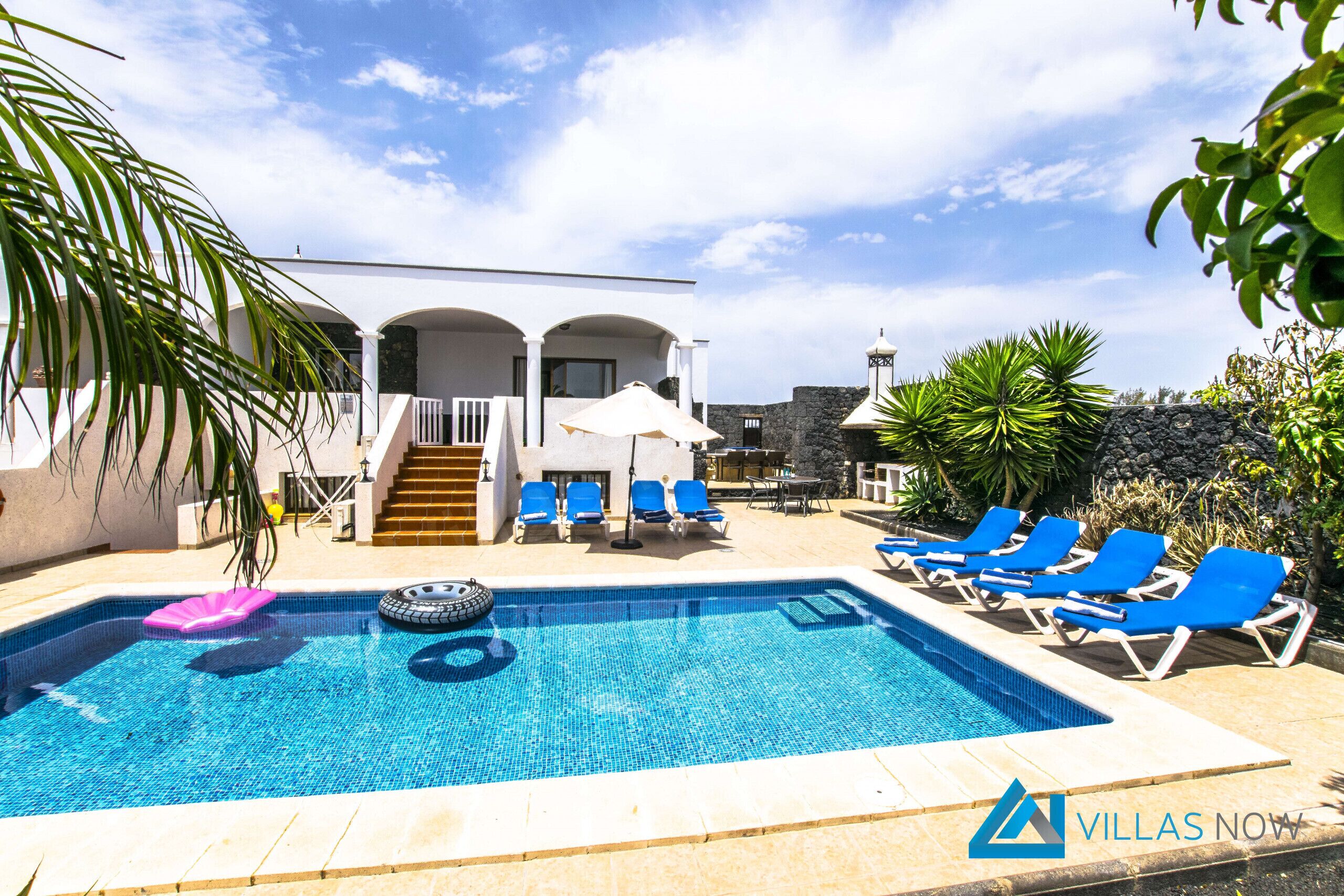 A heated pool, pool loungers