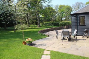 The garden and patio area in the Stables