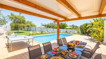 Outdoor pool, a heated pool, sun loungers
