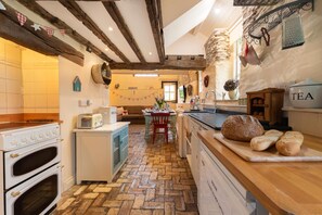 A quaint well-equipped kitchen area