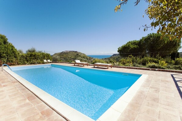 A rectangular swimming pool with a clear blue water surface, surrounded by a tiled deck. - Tuscany, Porto Ercole - Splendid villa with pool and large private garden (Monte Argentario)