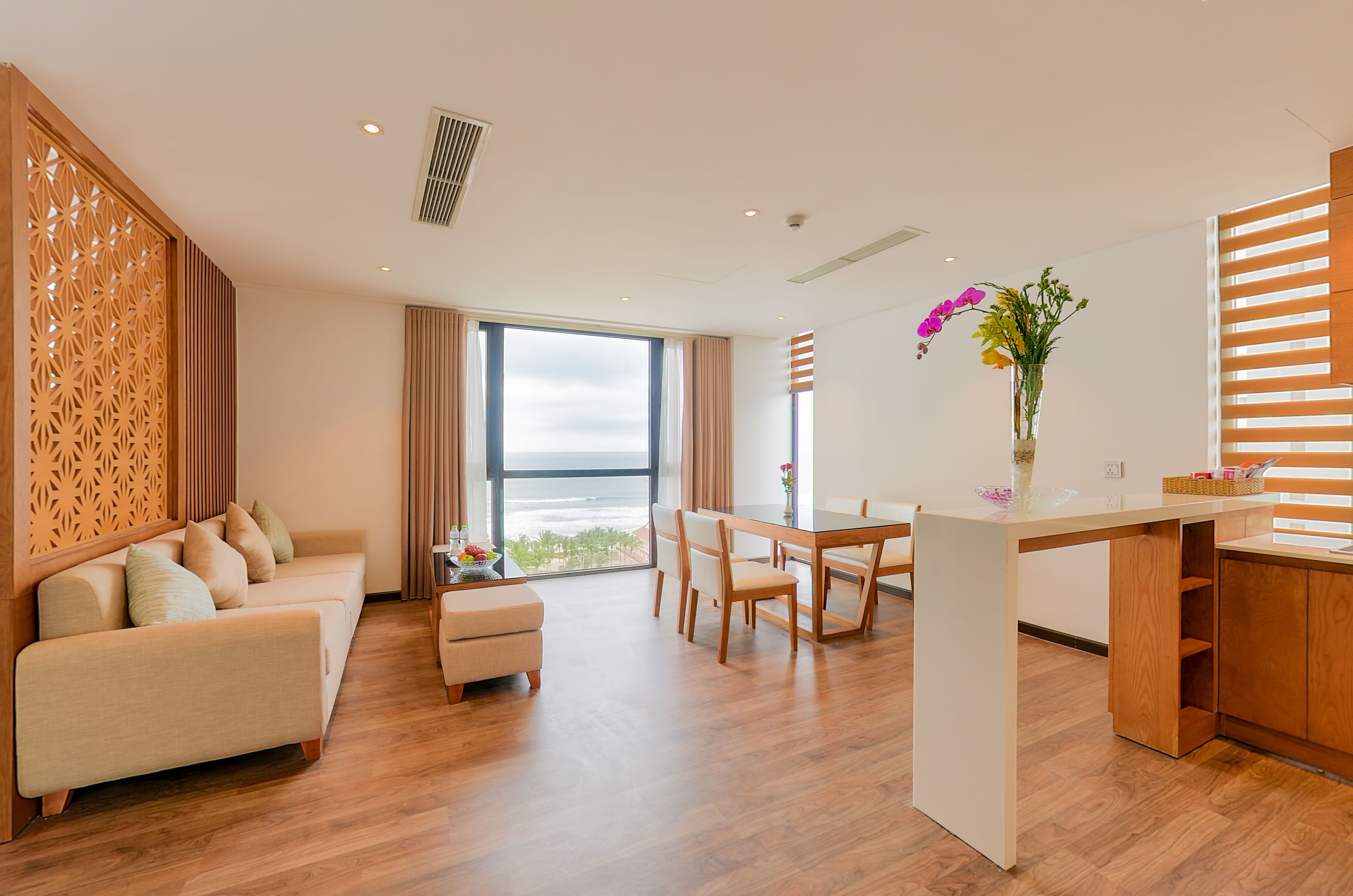 deluxe triple room | living area | flat-screen tv