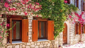 A stone building with wooden shutters and pink flowers. - Villa Rachi - Four Bedroom Villa, Sleeps 8 (Rachi)