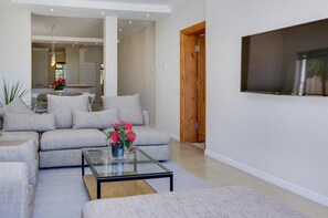 Apartment | Living room | 32-inch LCD TV with satellite channels, TV - Jumeirah Blue - Four Bedroom House, Sleeps 8 (Cape Town)