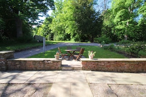 The Studio patio and garden leading into woodlands