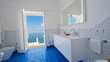 Bathtub, hair dryer, bidet, towels