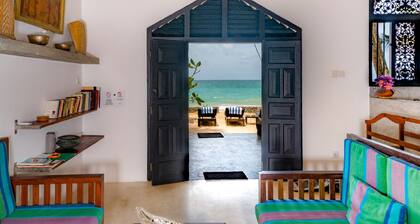 Blue Parrot Beach Villa Righ on the white sand beach,
