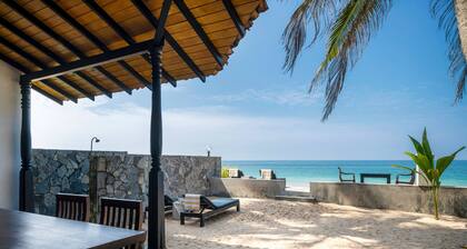 Blue Parrot Beach Villa Righ en la playa de arena blanca,