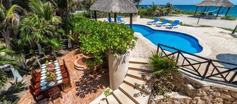 4 Bedroom oceanfront home centrally located in Akumal. Pool, AC, Wifi, Cook