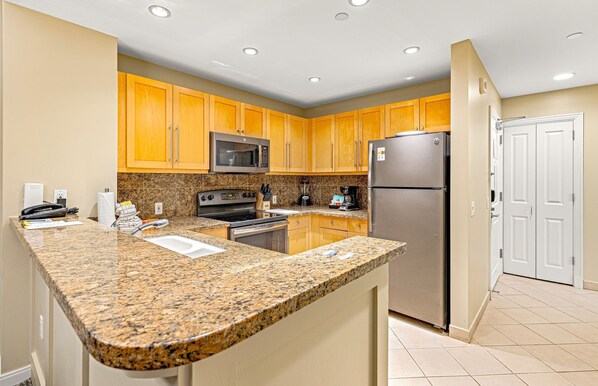 Coffee/tea maker, fridge, microwave, oven