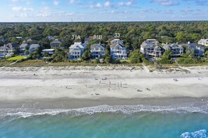 A beachfront property with numbered houses 31A, 31B, and 33. - 31A Dune Lane - This DIRECT oceanfront home will take your breath away! (Hilton Head Island)