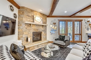 Flat-screen TV, fireplace, table tennis