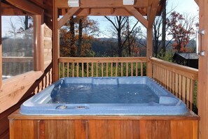 A wooden hot tub with a glass enclosure, surrounded by a wooden deck and a wooden pergola. - Privacy~Sunset View~Pet Friendly~Pool Table~Air Hockey (SEVIERVILLE)