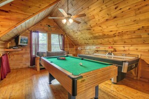 A wooden cabin with a pool table, a billiards table, and a ceiling fan. - Privacy~Sunset View~Pet Friendly~Pool Table~Air Hockey (SEVIERVILLE)