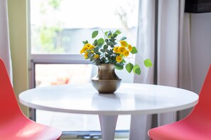Sit comfortably between the window and enjoy the view of lush greenery.