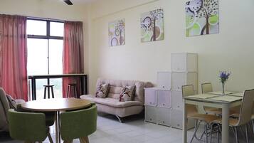 Condo, 2 Bedrooms | Living room | Flat-screen TV