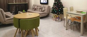 Condo, 2 Bedrooms | Living room | Flat-screen TV