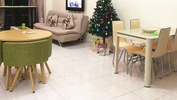 Condo, 2 Bedrooms | Living room | Flat-screen TV