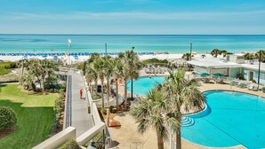 A resort with a pool, beach, and palm trees. - Beachfront 2BR Tops'l Resort! Balcony Beach Views, Tropical Pool, Pickleball (Miramar Beach)