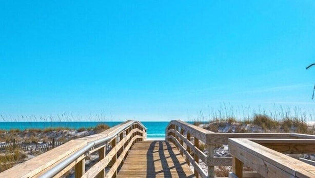 A wooden boardwalk leading to a beach with clear skies. - Gulf View! Coastal Chic! Mainsail 288! (Miramar Beach)