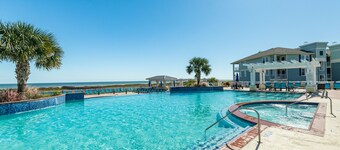 Bayfront condo with scenic views, pool & hot tub - near the beach
