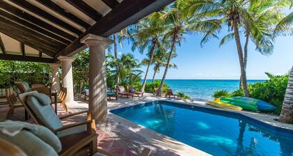 Beautiful Hacienda style villa located on white sandy beach, pool, AC, WiFi!