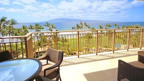A balcony with a view of the ocean and palm trees. - Maui Resort Rentals: Hyatt Residence Club – 2BR Oceanfront Middle Floor VIlla (Lahaina)
