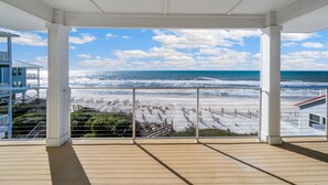 A covered balcony with a view of the beach and ocean. - Just Coastin: Great Gulf Views, Screened Porch, Pet Friendly (Cape San Blas)
