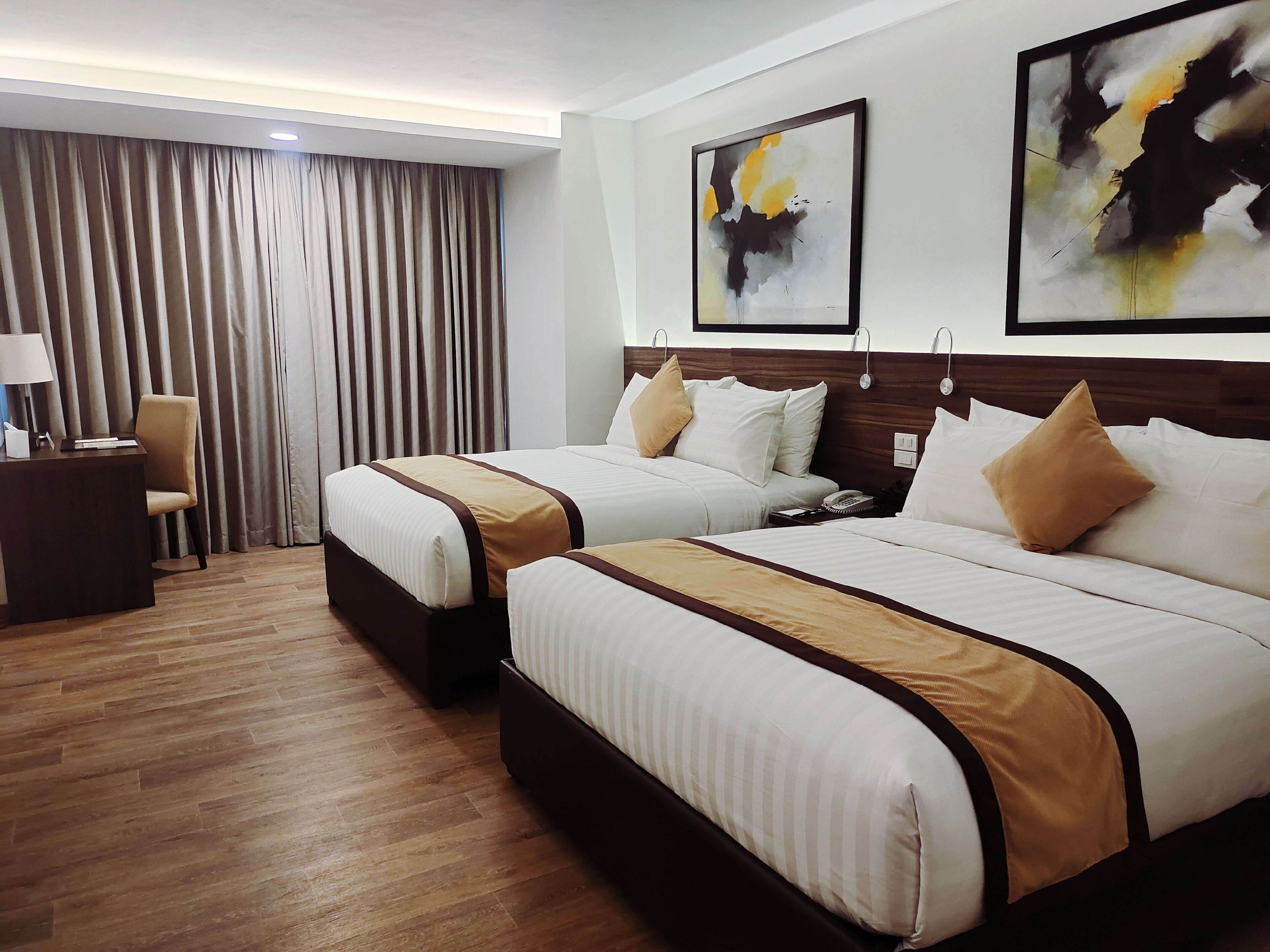 deluxe room, 2 queen beds | minibar, in-room safe, desk, laptop workspace