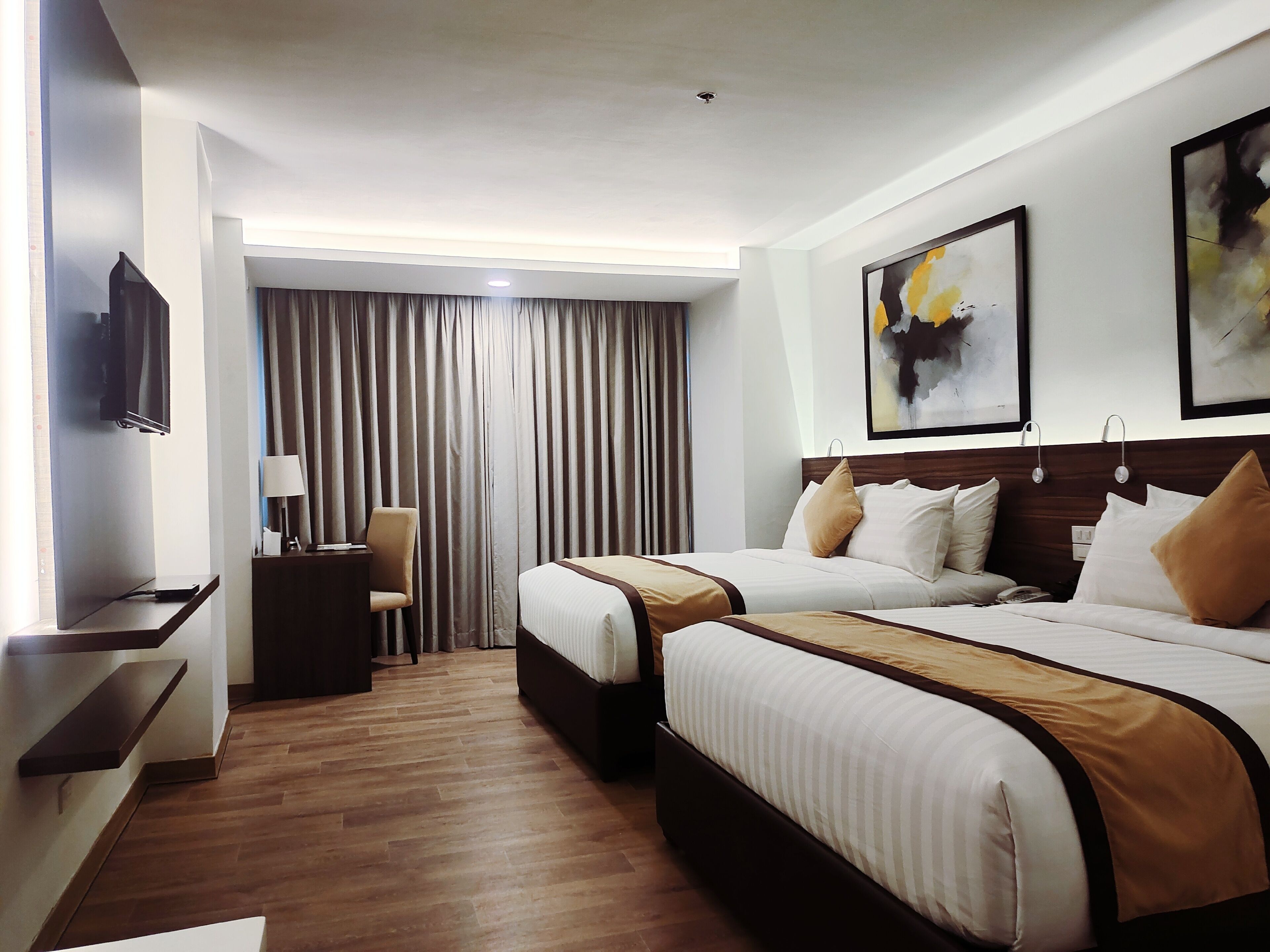 deluxe room, 2 queen beds | minibar, in-room safe, desk, laptop workspace