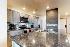 Fridge, microwave, oven, stovetop - Lakefront Condo with Mountain Views & Shared Hot Tub - Walk to Town & Ski Access (Dillon)