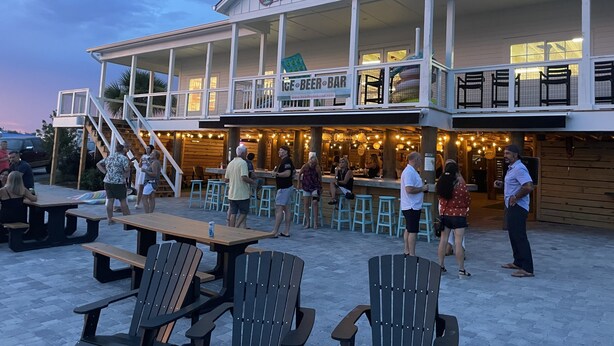 A beachfront bar with outdoor seating and a covered patio area. - 19 GulfBreeze Court👙Destin, FL🐟Pet Friendly🐶 (Destin)