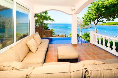 Relax into luxury at our West End beachfront villa—with private pool