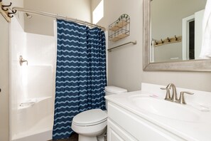 Enjoy a refreshing shower or soak in the bathtub, then freshen up at the sink with a modern faucet.