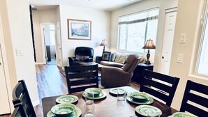 A dining area with a wooden table set for six, surrounded by black chairs. - Fortune's Edge Retreat by Mesquite Vacation Rentals: Ground Level with 2 Car Garage and $510 in free daily activities (Mesquite)