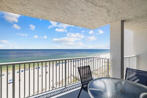 A balcony with a view of the beach and ocean. - Romar Tower 9A by Liquid Life (Orange Beach)