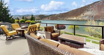 Dog-friendly waterfront home with pool, tennis courts, & large lawn
