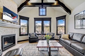 Flat-screen TV, fireplace, DVD player, stereo