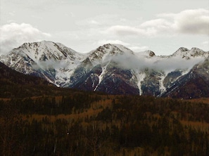 A mountain landscape with snow-capped peaks and a forested valley. - Rustic & Spacious Log Cabin w/Private Hot Tub, Amazing Views, 4 Miles to Ski (Durango)