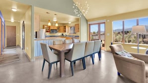 A spacious kitchen with modern appliances, a dining area with a large table and chairs, and a balcony with a view. - • Dog Friendly • Walk to Everything • Great Outdoor Space! (Salida)