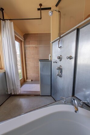 Bathtub, hair dryer, towels, soap