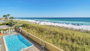 A pool area with a view of the beach and ocean. - Recently updated 2 bedroom-Beach Front Condo-Sleeps 6-Beach Service Included!! (Fort Walton Beach)