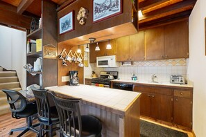 Fridge, microwave, oven, stovetop - Bright Olympic Valley condo with free WiFi, fireplace, and deck (Squaw Valley)