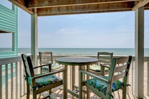 Outdoor dining - Ocean Dunes 1806 - Open oceanfront three bedroom condo with great views (Kure Beach)