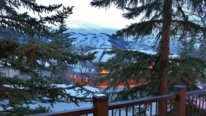 A snow-covered landscape with a building in the background. - Indulge in Luxury - Perfect for Groups with Private Hot Tub & Posturepedic Beds! (Park City)
